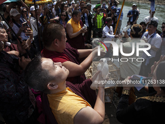 Buddhist monks are releasing doves in the Fang Sen ritual, or releasing animals into nature, as part of a series of worship ahead of Vesak D...