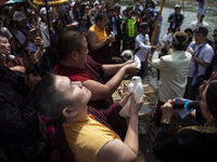 Buddhist monks are releasing doves in the Fang Sen ritual, or releasing animals into nature, as part of a series of worship ahead of Vesak D...