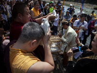 Buddhist monks are releasing doves in the Fang Sen ritual, or releasing animals into nature, as part of a series of worship ahead of Vesak D...