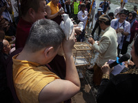 Buddhist monks are releasing doves in the Fang Sen ritual, or releasing animals into nature, as part of a series of worship ahead of Vesak D...