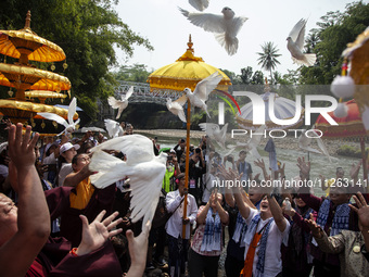 Buddhist monks are releasing doves in the Fang Sen ritual, or releasing animals into nature, as part of a series of worship ahead of Vesak D...