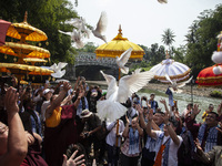 Buddhist monks are releasing doves in the Fang Sen ritual, or releasing animals into nature, as part of a series of worship ahead of Vesak D...