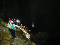 Outdoor lovers are exploring an underground karst cave in Qiannan Buyi and Miao autonomous Prefecture, in Qiannan, China, on May 22, 2024. (