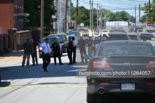 Police are gathering at the crime scene. Two people are dying, and three people are getting injured in a workplace shooting at Delaware Coun...