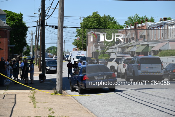 Police are gathering at the crime scene. Two people are dying, and three people are getting injured in a workplace shooting at Delaware Coun...