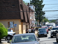 The crime scene unit is gathering at the scene of the workplace mass shooting that is leaving two dead and three injured. Police are gatheri...