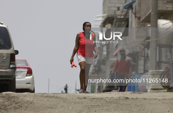 A Haitian migrant is staying inside the property known as El Yuguelito, an irregular piece of land located in the Polvorilla Colony in the I...