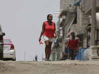 A Haitian migrant is staying inside the property known as El Yuguelito, an irregular piece of land located in the Polvorilla Colony in the I...