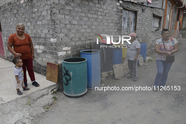 People are using boats to store water for their homes inside the property known as El Yuguelito, an irregular piece of land located in the P...