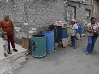 People are using boats to store water for their homes inside the property known as El Yuguelito, an irregular piece of land located in the P...