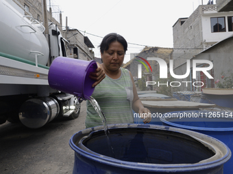 People are using boats to store water for their homes inside the property known as El Yuguelito, an irregular piece of land located in the P...