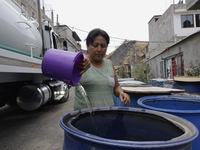 People are using boats to store water for their homes inside the property known as El Yuguelito, an irregular piece of land located in the P...