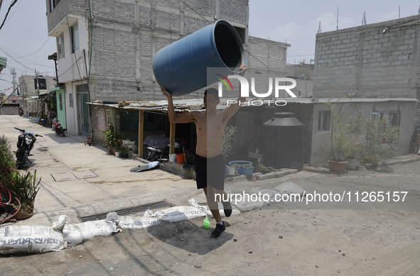 People are using boats to store water for their homes inside the property known as El Yuguelito, an irregular piece of land located in the P...