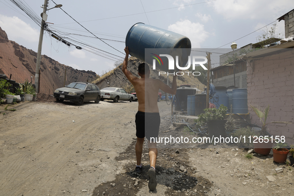 People are using boats to store water for their homes inside the property known as El Yuguelito, an irregular piece of land located in the P...