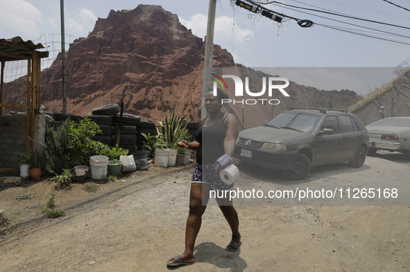 A Haitian migrant is staying inside the property known as El Yuguelito, an irregular piece of land located in the Polvorilla Colony in the I...