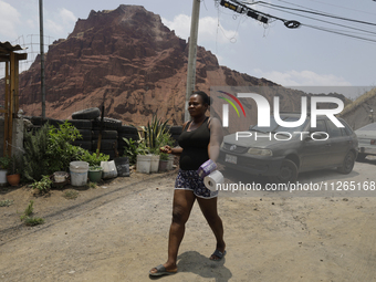 A Haitian migrant is staying inside the property known as El Yuguelito, an irregular piece of land located in the Polvorilla Colony in the I...