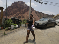 A Haitian migrant is staying inside the property known as El Yuguelito, an irregular piece of land located in the Polvorilla Colony in the I...