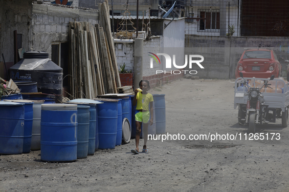 A Haitian migrant is staying inside the property known as El Yuguelito, an irregular piece of land located in the Polvorilla Colony in the I...