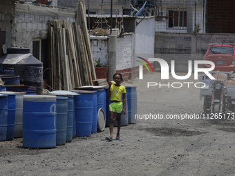 A Haitian migrant is staying inside the property known as El Yuguelito, an irregular piece of land located in the Polvorilla Colony in the I...