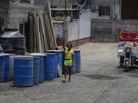 A Haitian migrant is staying inside the property known as El Yuguelito, an irregular piece of land located in the Polvorilla Colony in the I...