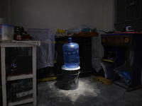 A jug is sitting inside a home on the property known as El Yuguelito, an irregular piece of land located in the Polvorilla Colony in the Izt...