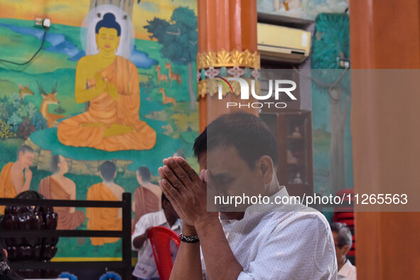 A man is praying at a monastery on the occasion of Buddha Purnima in Kolkata, India, on May 23, 2024. Buddha Purnima, or Buddha's birthday,...