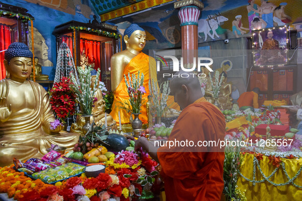 Indian Buddhist monks are decorating a statue of Lord Buddha at a monastery on the occasion of Buddha Purnima in Kolkata, India, on May 23,...