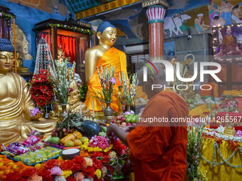 Indian Buddhist monks are decorating a statue of Lord Buddha at a monastery on the occasion of Buddha Purnima in Kolkata, India, on May 23,...