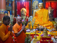 Indian Buddhist monks are offering prayers in front of a statue of Gautam Buddha at a monastery in Kolkata, India, on May 23, 2024. Buddha P...