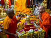 Indian Buddhist monks are offering prayers to a relic of Gautam Buddha, which contains remains of Buddha, at a monastery in Kolkata, India,...