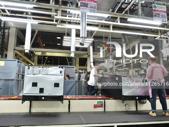 Workers are assembling refrigerators at the LG Refrigerator production base in Taizhou, China, on May 23, 2024. This is LG's largest refrige...