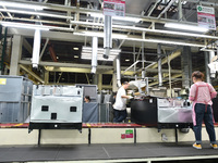 Workers are assembling refrigerators at the LG Refrigerator production base in Taizhou, China, on May 23, 2024. This is LG's largest refrige...