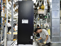 Workers are assembling refrigerators at the LG Refrigerator production base in Taizhou, China, on May 23, 2024. This is LG's largest refrige...