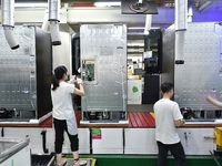 Workers are assembling refrigerators at the LG Refrigerator production base in Taizhou, China, on May 23, 2024. This is LG's largest refrige...