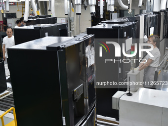 Workers are assembling refrigerators at the LG Refrigerator production base in Taizhou, China, on May 23, 2024. This is LG's largest refrige...