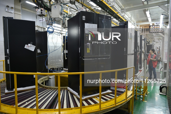 Workers are assembling refrigerators at the LG Refrigerator production base in Taizhou, China, on May 23, 2024. This is LG's largest refrige...