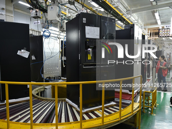 Workers are assembling refrigerators at the LG Refrigerator production base in Taizhou, China, on May 23, 2024. This is LG's largest refrige...