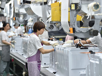 Workers are assembling refrigerators at the LG Refrigerator production base in Taizhou, China, on May 23, 2024. This is LG's largest refrige...