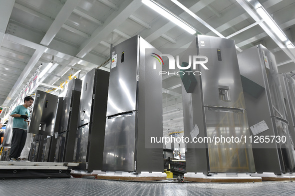 Workers are assembling refrigerators at the LG Refrigerator production base in Taizhou, China, on May 23, 2024. This is LG's largest refrige...