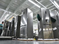 Workers are assembling refrigerators at the LG Refrigerator production base in Taizhou, China, on May 23, 2024. This is LG's largest refrige...