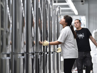 Workers are assembling refrigerators at the LG Refrigerator production base in Taizhou, China, on May 23, 2024. This is LG's largest refrige...