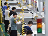 Workers are assembling refrigerators at the LG Refrigerator production base in Taizhou, China, on May 23, 2024. This is LG's largest refrige...