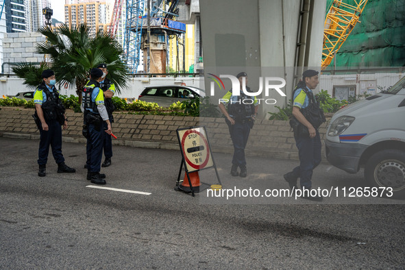 A police roadblock is near the courthouse where the trial of Jimmy Lai, the founder of the now-shuttered Apple Daily Newspaper, is taking pl...