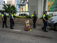 A police roadblock is near the courthouse where the trial of Jimmy Lai, the founder of the now-shuttered Apple Daily Newspaper, is taking pl...