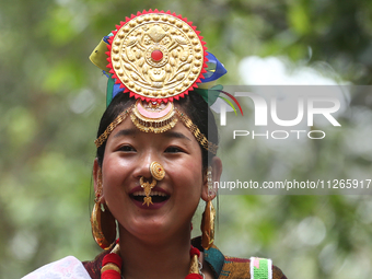 A Nepalese girl from the Kirat community is wearing traditional attire during the Ubhauli festival in Lalitpur, Nepal, on May 23, 2024. (