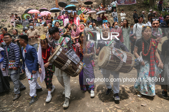 Nepalese people from the Kirat community are wearing traditional attire and playing and dancing during the Ubhauli festival in Lalitpur, Nep...