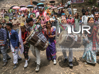 Nepalese people from the Kirat community are wearing traditional attire and playing and dancing during the Ubhauli festival in Lalitpur, Nep...