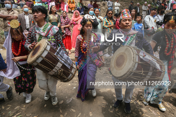 Nepalese people from the Kirat community are wearing traditional attire and playing and dancing during the Ubhauli festival in Lalitpur, Nep...