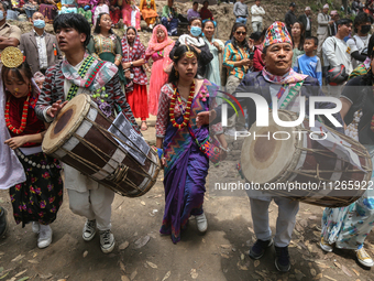 Nepalese people from the Kirat community are wearing traditional attire and playing and dancing during the Ubhauli festival in Lalitpur, Nep...