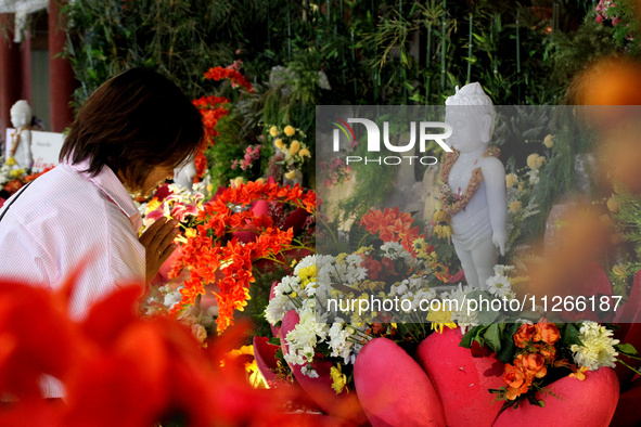 A Buddhist is praying to coincide with Vesak Day 2024 at Maha Vihara Maitreya in Medan Estate, Deli Serdang Regency, North Sumatra, Indonesi...